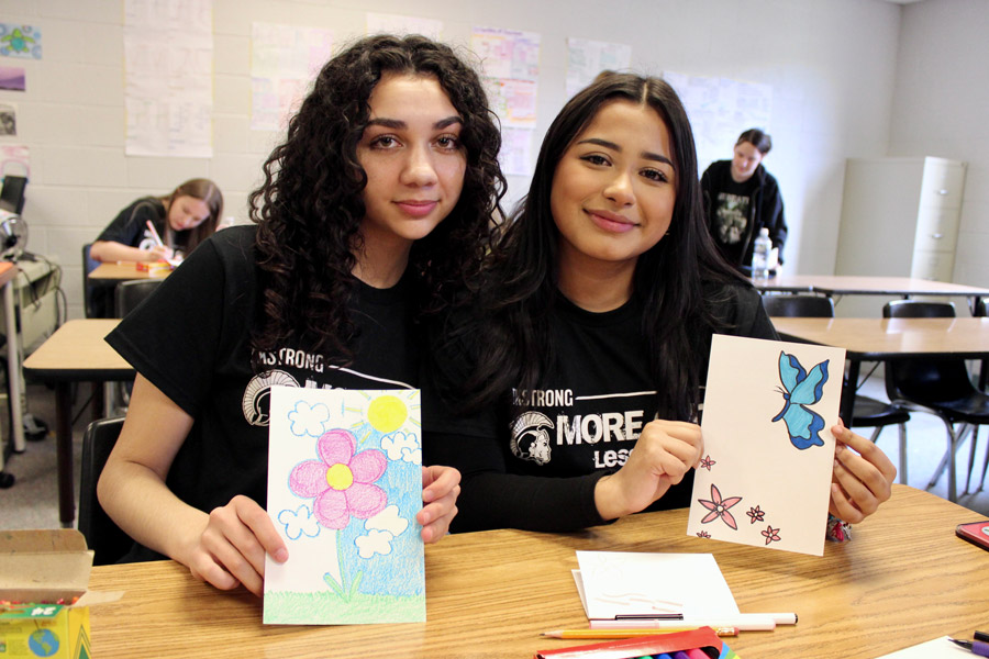 Sophomores Aaliyah Rodriguez, left, and Joshelin Zavatza-Nava decorate tags for IV bags at Helen DeVos Children’s Hospital in Grand Rapids