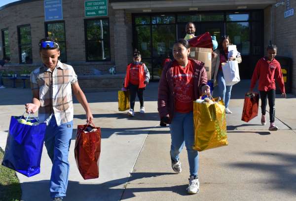 Students and staff from House Fire load up the stuffed animals and cards